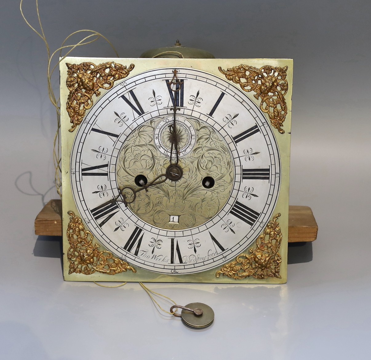 An 18th century brass eight day longcase clock movement, with silvered chapter ring, subsidiary seconds and date aperture marked Thomas Weeks, 28cm sq.